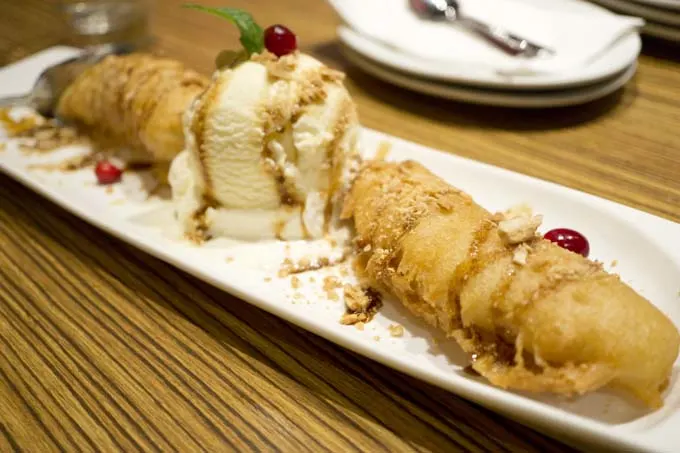 pisang goreng with ice cream and crushed peanuts