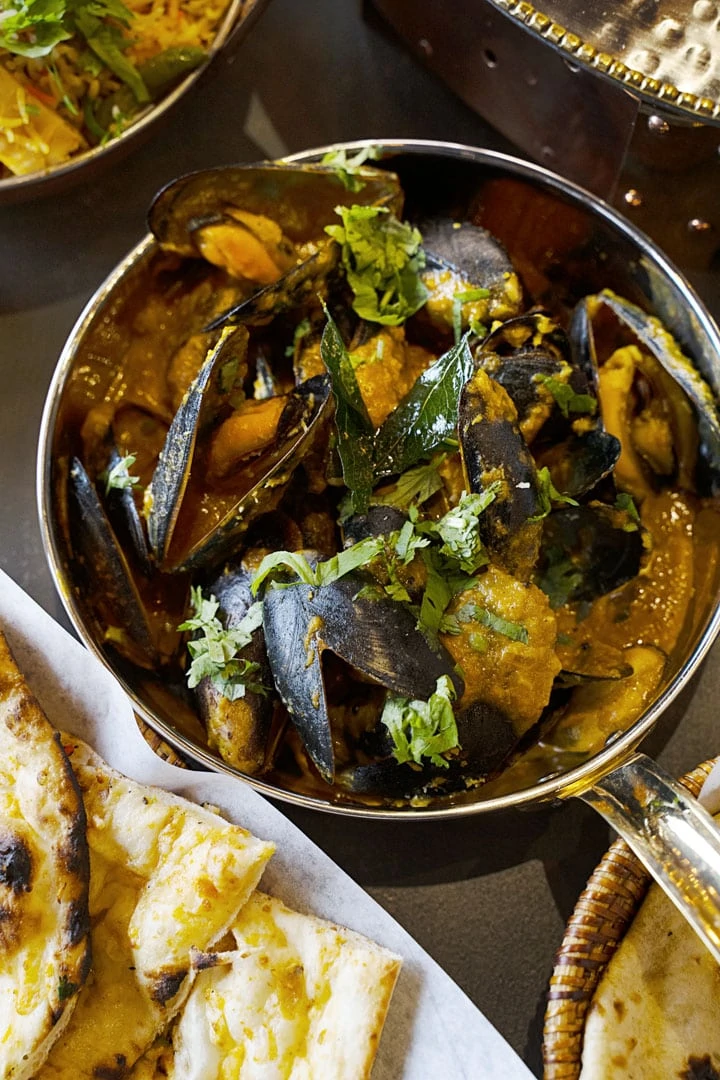 Marvai Gassi (Dairy & Gluten Free)
Mussels cooked with caramelized onions, lime, lemon zest, tamarind and coconut