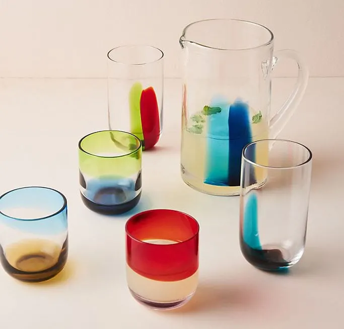 Distinguished by a colorful motif rendered in soda lime glass, these multicolored old fashion glassware lends vibrancy to a home bar or drinks cart.