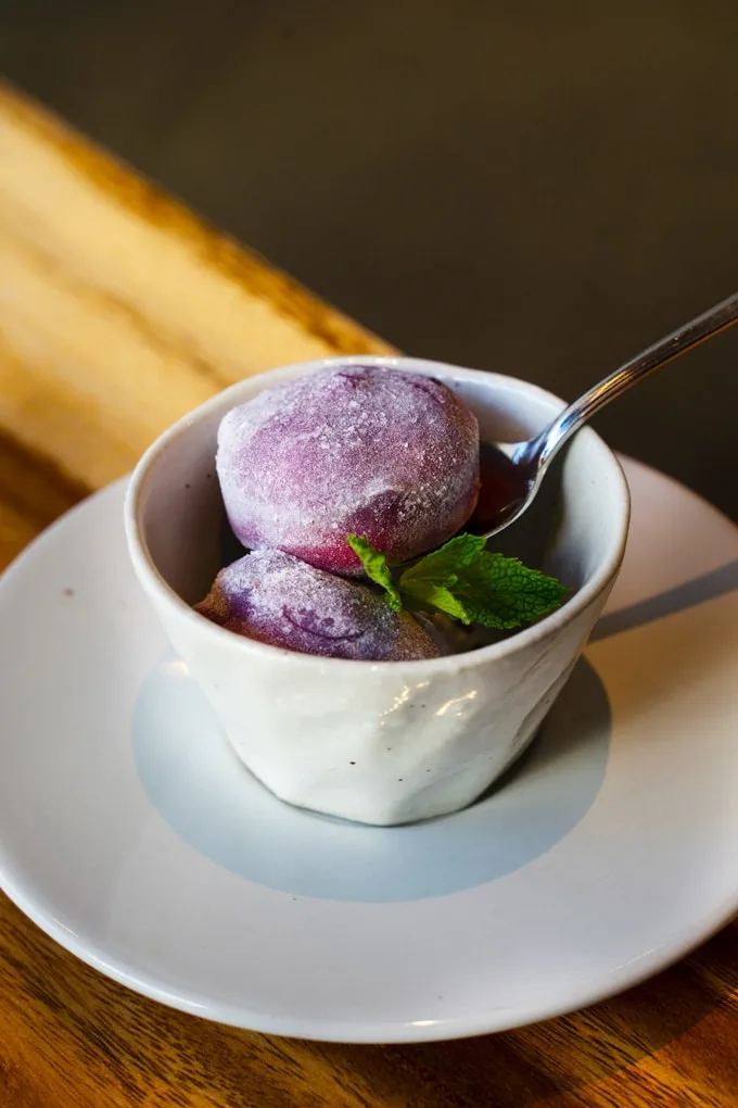 a passionfruit Japanese ice cream mochi with dried lavender