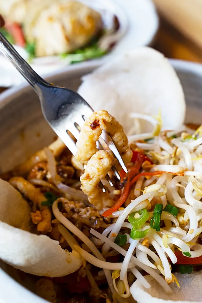 sautéed housemade fish noodles, egg, vegetables, tamarind sauce, roasted peanuts, and shrimp chips