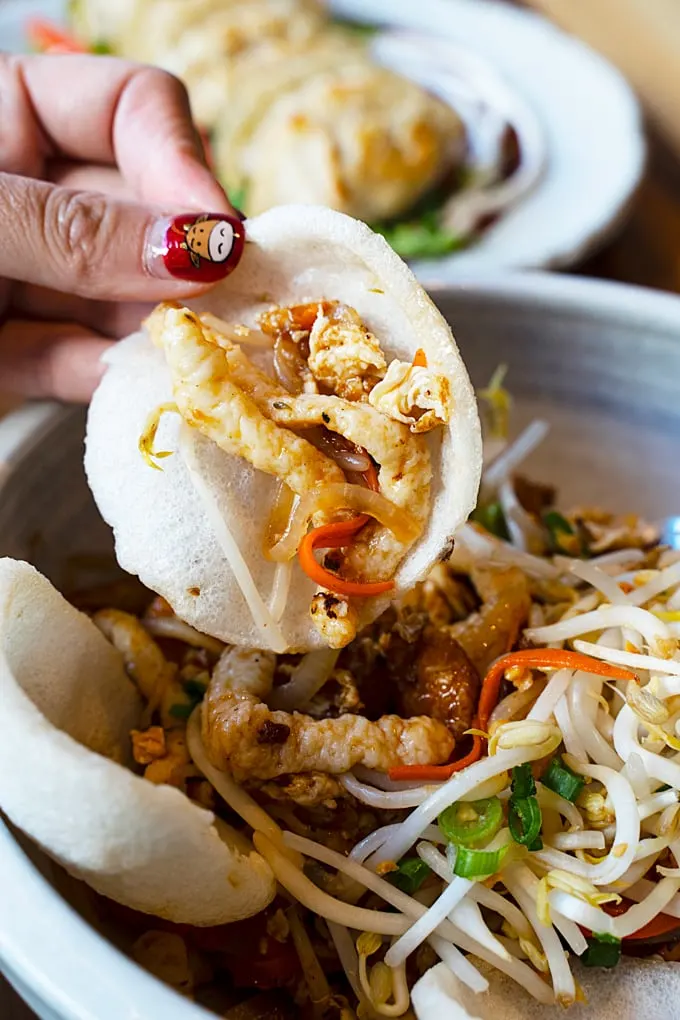 sautéed housemade fish noodles, egg, vegetables, tamarind sauce, roasted peanuts, and shrimp chips