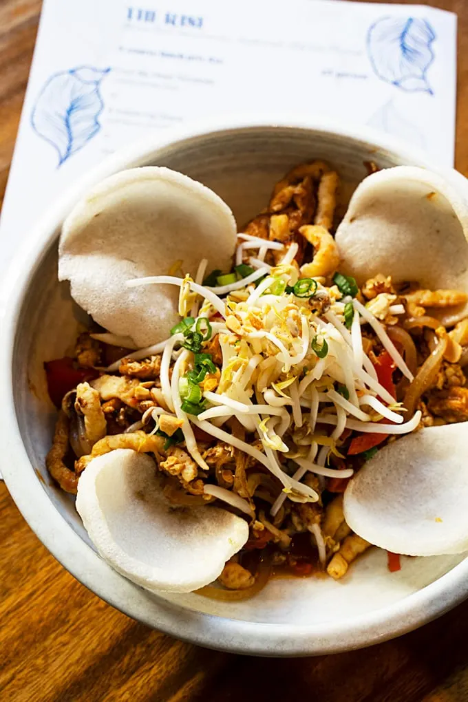 sautéed housemade fish noodles, egg, vegetables, tamarind sauce, roasted peanuts, and shrimp chips