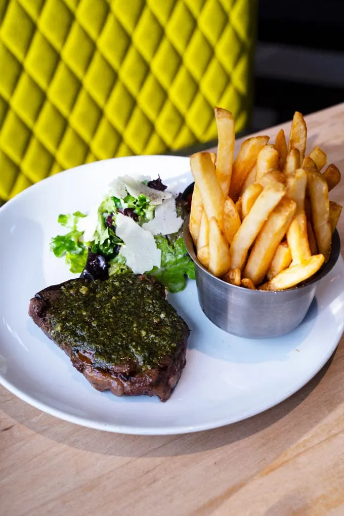Steak Frites – a 7ox certified Angus beef sirloin with chimichurri, fresh greens and fries