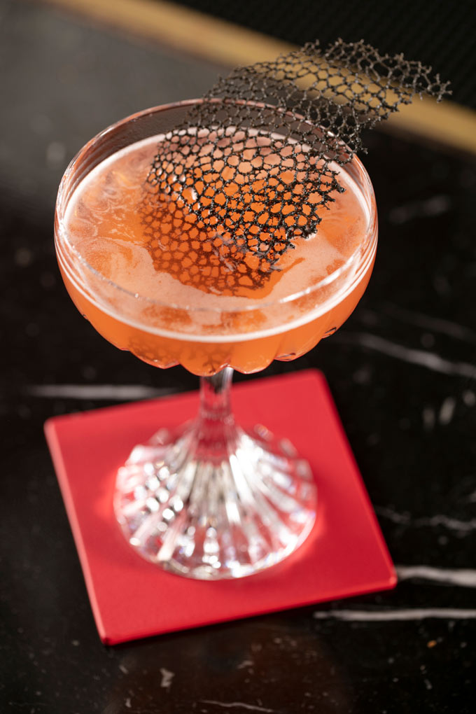 Presentation of the L'Art du Cocktail menu at the Baccarat Hotel New York
