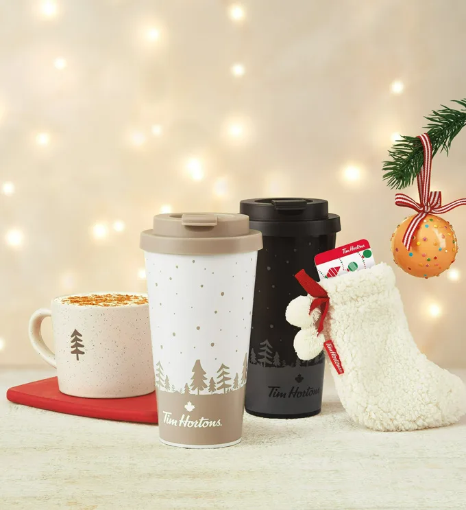 New Tim Hortons Sherpa throw, stocking, snow globe, and festive socks, among the giftable items in the 2022 Tims Holiday Merchandise Collection