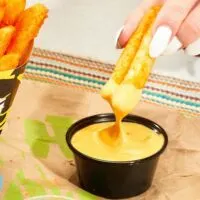 More Reasons To Love Nacho Fries: Taco Bell&reg; Introduces Vegan Nacho Sauce Nationwide And New Larger Size!
