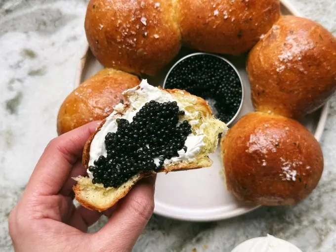 A luxurious herbed brioche bun infused with chives, ramps, dill and sea salt and served with lemon labneh featuring a touch of zest for a unique presentation. Caviar Russe’s classic Osetra caviar completes the ensemble.