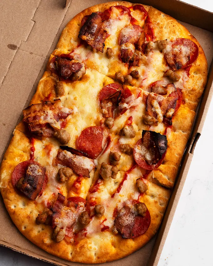 Tim Hortons Introduces New 3 Meat Hat-Trick Flatbread Pizza and Garlic Bread